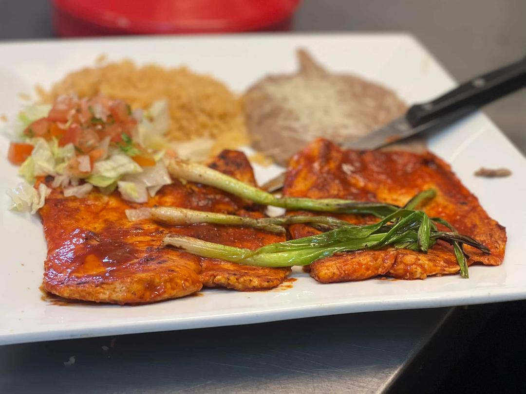 Grilled Mexican steak with peppers and sides